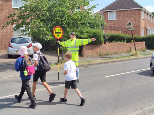 school children crossing the road