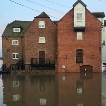 A house with floodwater in front