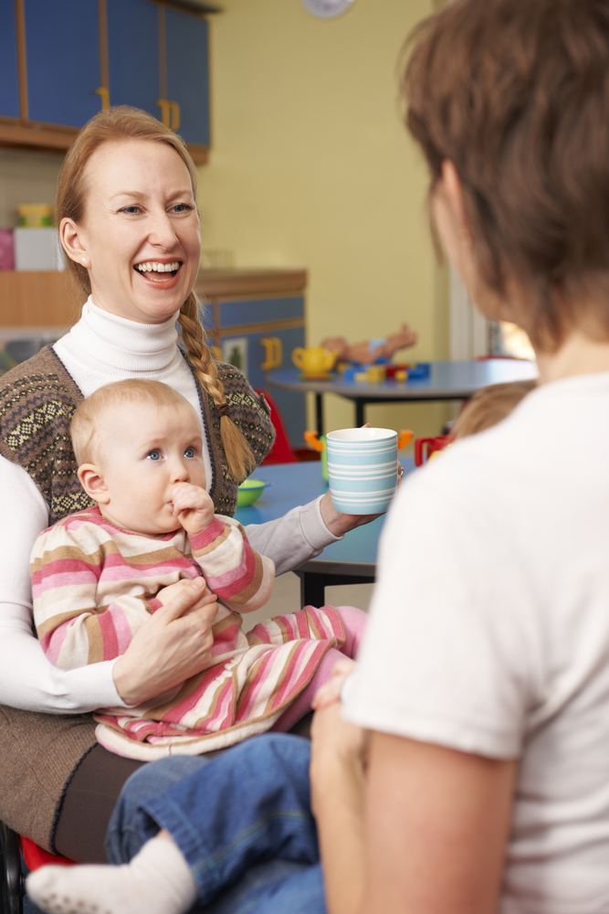Women with babies chatting at a baby group