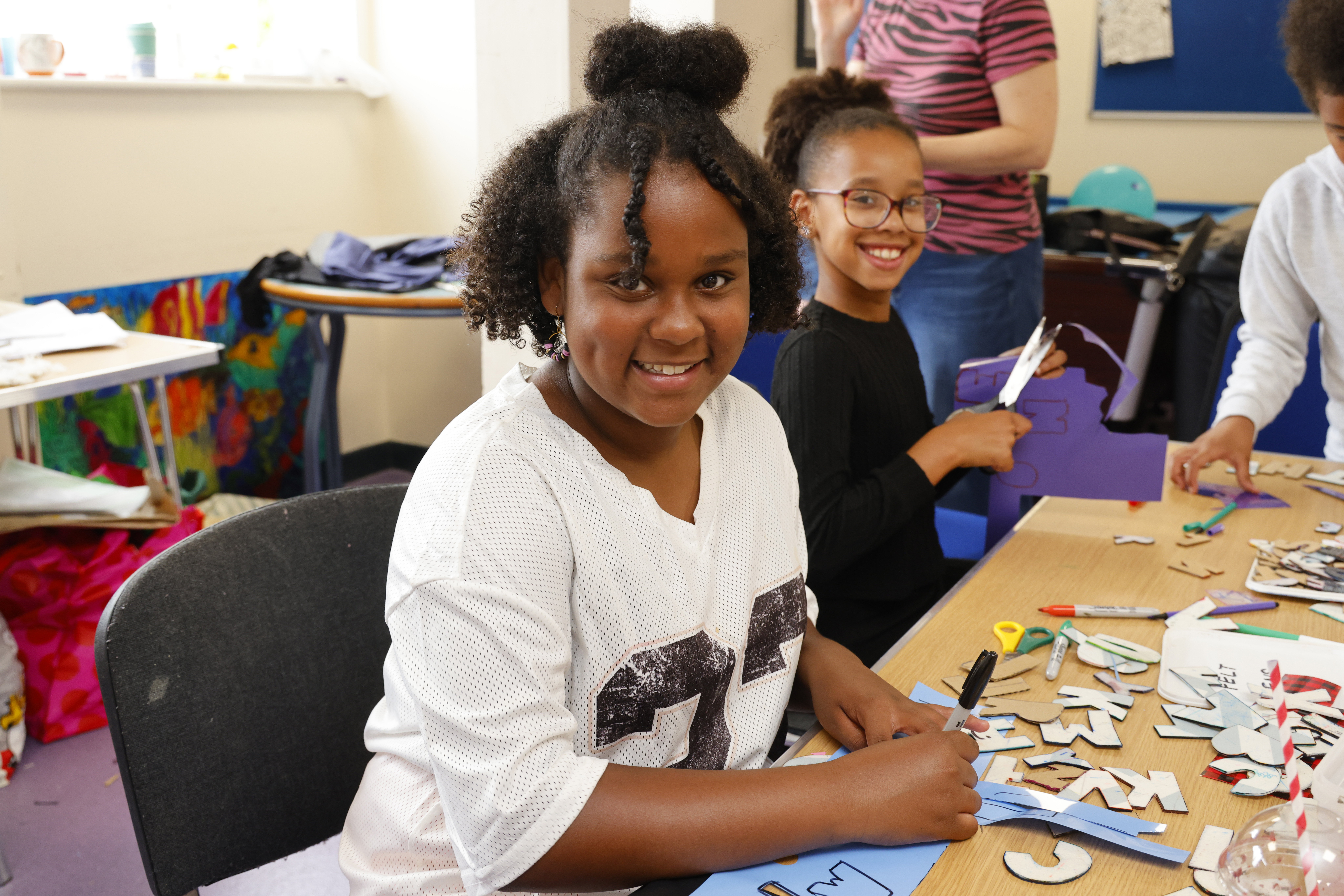 Smiling young people at youth centre
