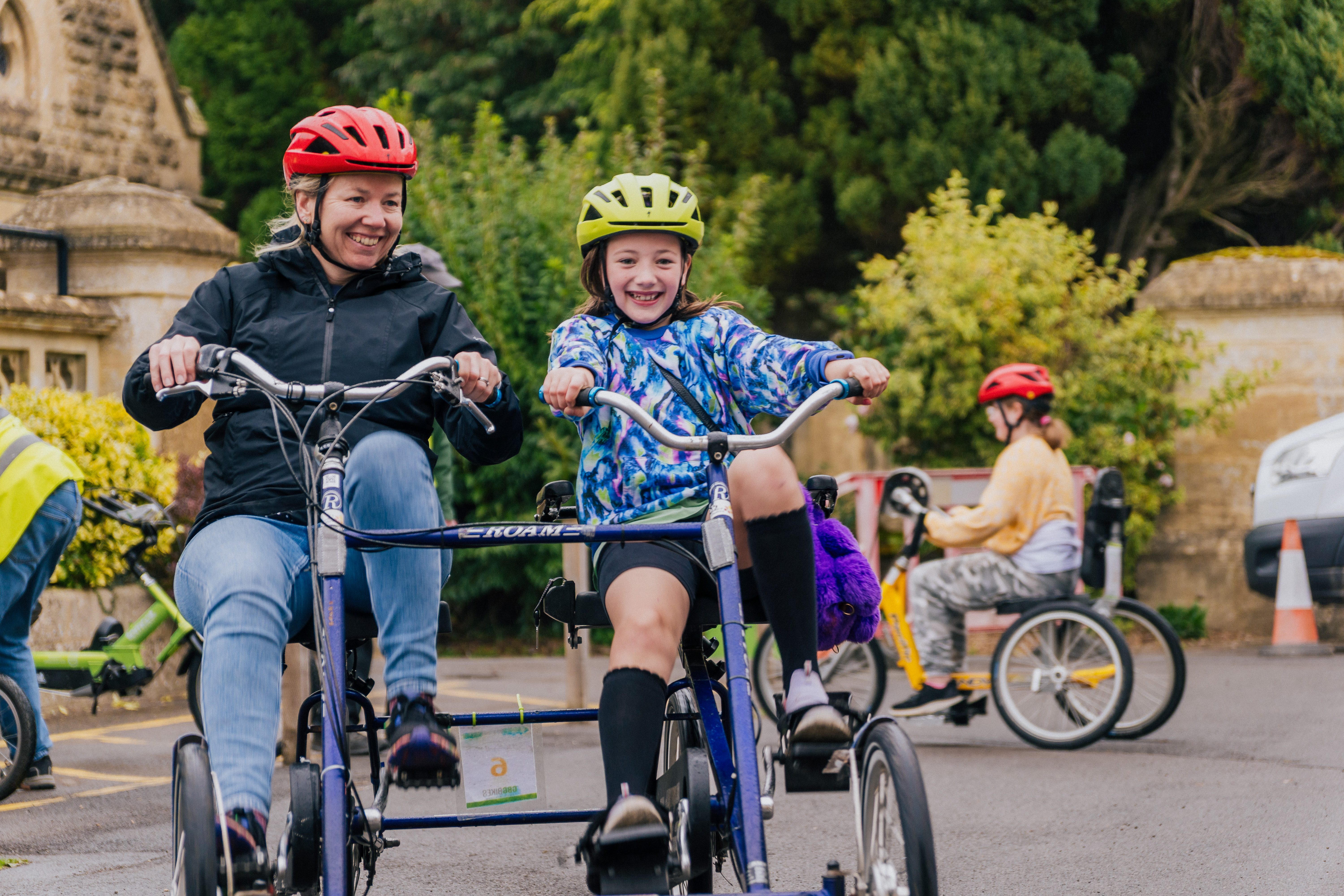 a parent and a child cycling a bicycle