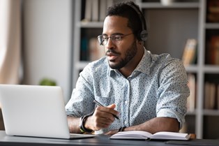A man at his computer working