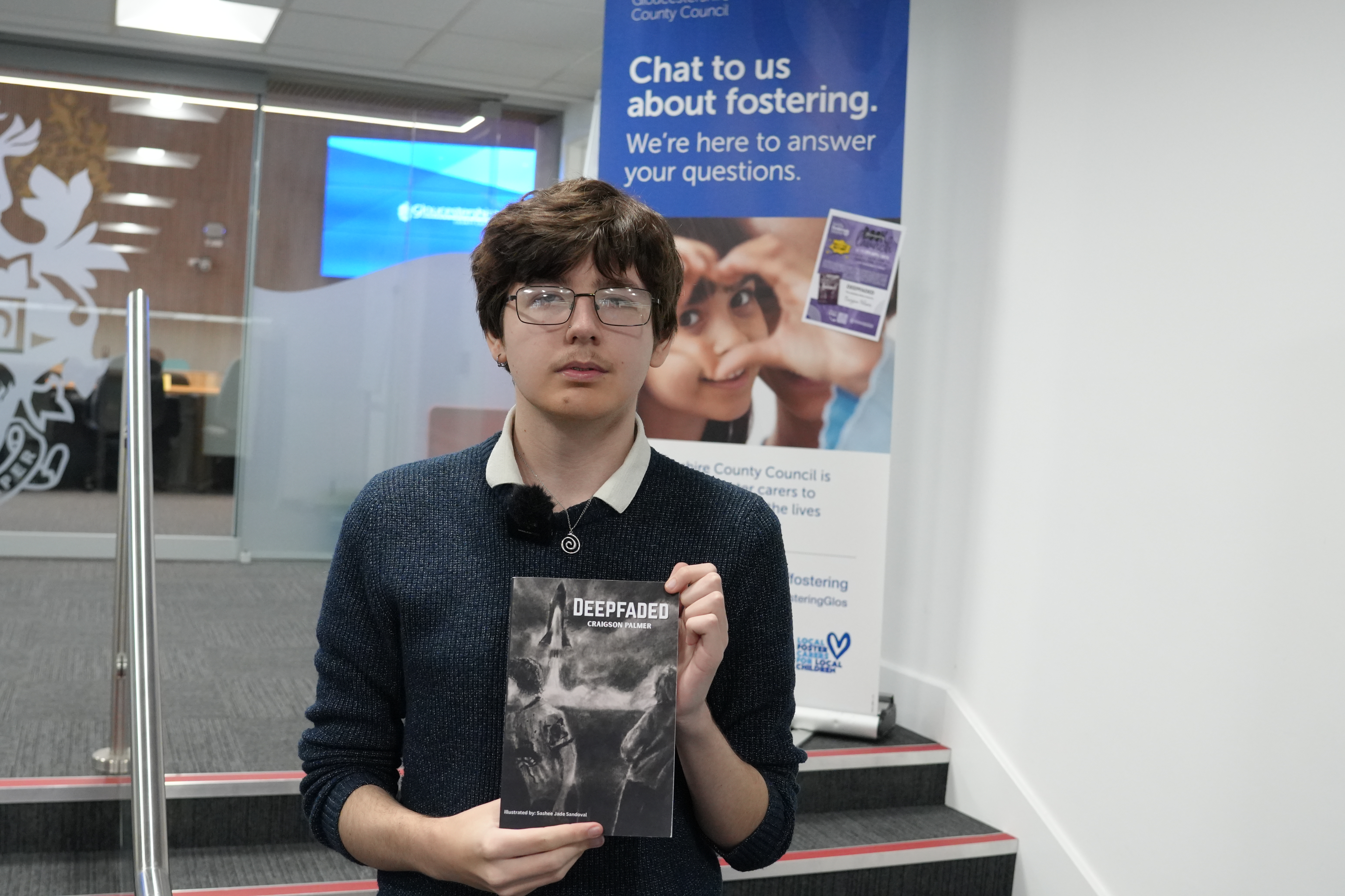 An image of Craigson Palmer with his book, Deepfaded