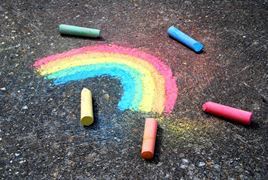 A rainbow drawn in chalk on the ground