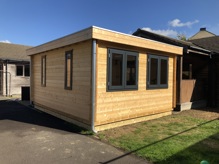 Exterior view of the new timber cabin with breakout space at The Shrubberies